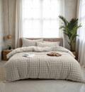Light beige textured duvet cover set styled on a double bed