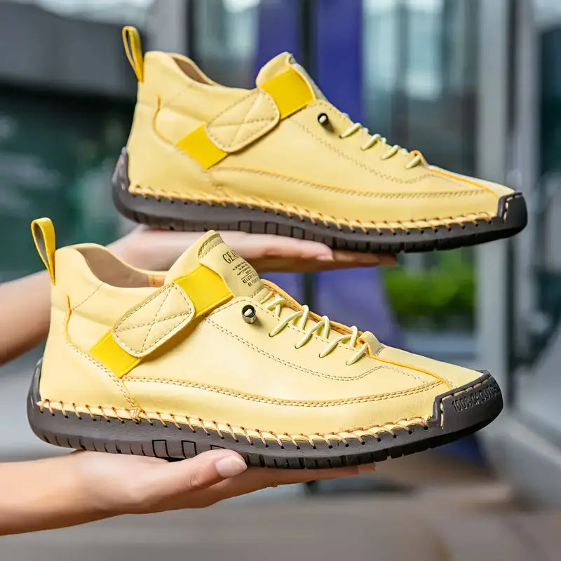 Women's ankle-height lace-up sneakers with contrast stitching and a flat ridged sole
