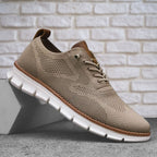 Knit lace-up walking shoe with a round toe, contrast trim and flat cut-out sole