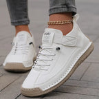 Women's ankle-height lace-up sneakers with contrast stitching and a flat ridged sole