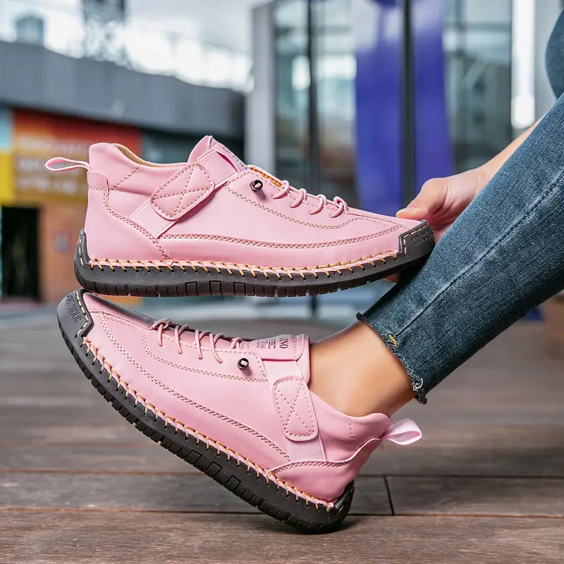 High-top lace-up trainers with ankle strap detail and stitched flat soles