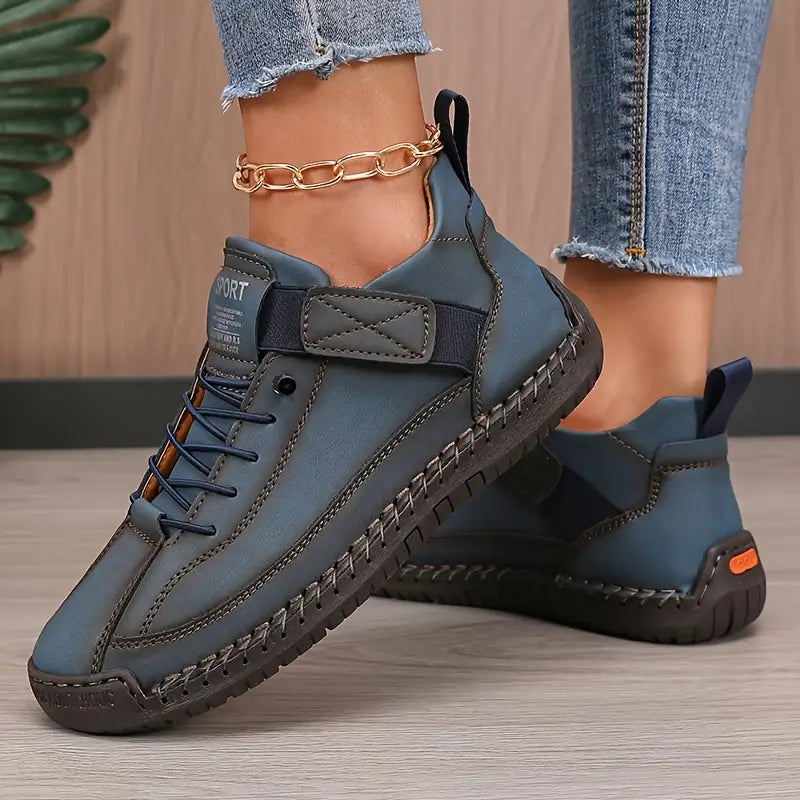 High-top lace-up trainers with ankle strap detail and stitched flat soles