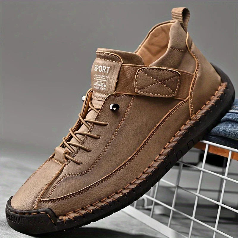 High-top lace-up trainers with ankle strap detail and stitched flat soles