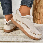 Women's low-cut ankle boots with light trim, stitched detailing and textured flat soles