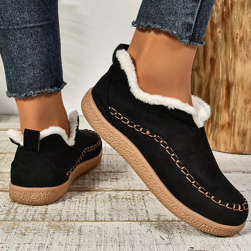 Women's low-cut ankle boots with light trim, stitched detailing and textured flat soles