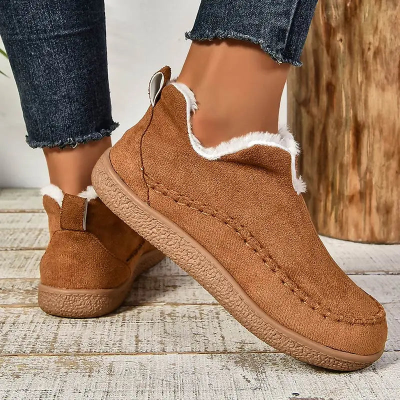 Women's low-cut ankle boots with light trim, stitched detailing and textured flat soles