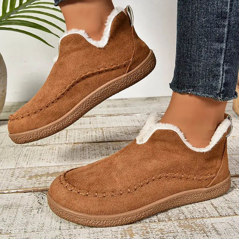 Women's low-cut ankle boots with light trim, stitched detailing and textured flat soles