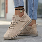 Women's ankle-height lace-up sneakers with contrast stitching and a flat ridged sole