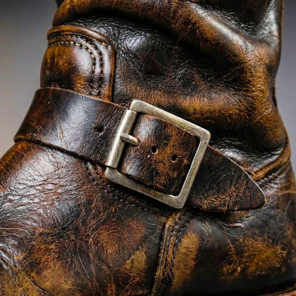Vintage mid-calf boots with round toes, slouch shafts and buckle straps