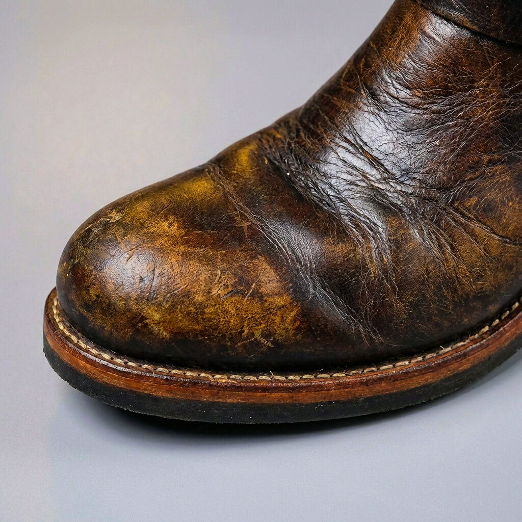 Vintage mid-calf boots with round toes, slouch shafts and buckle straps